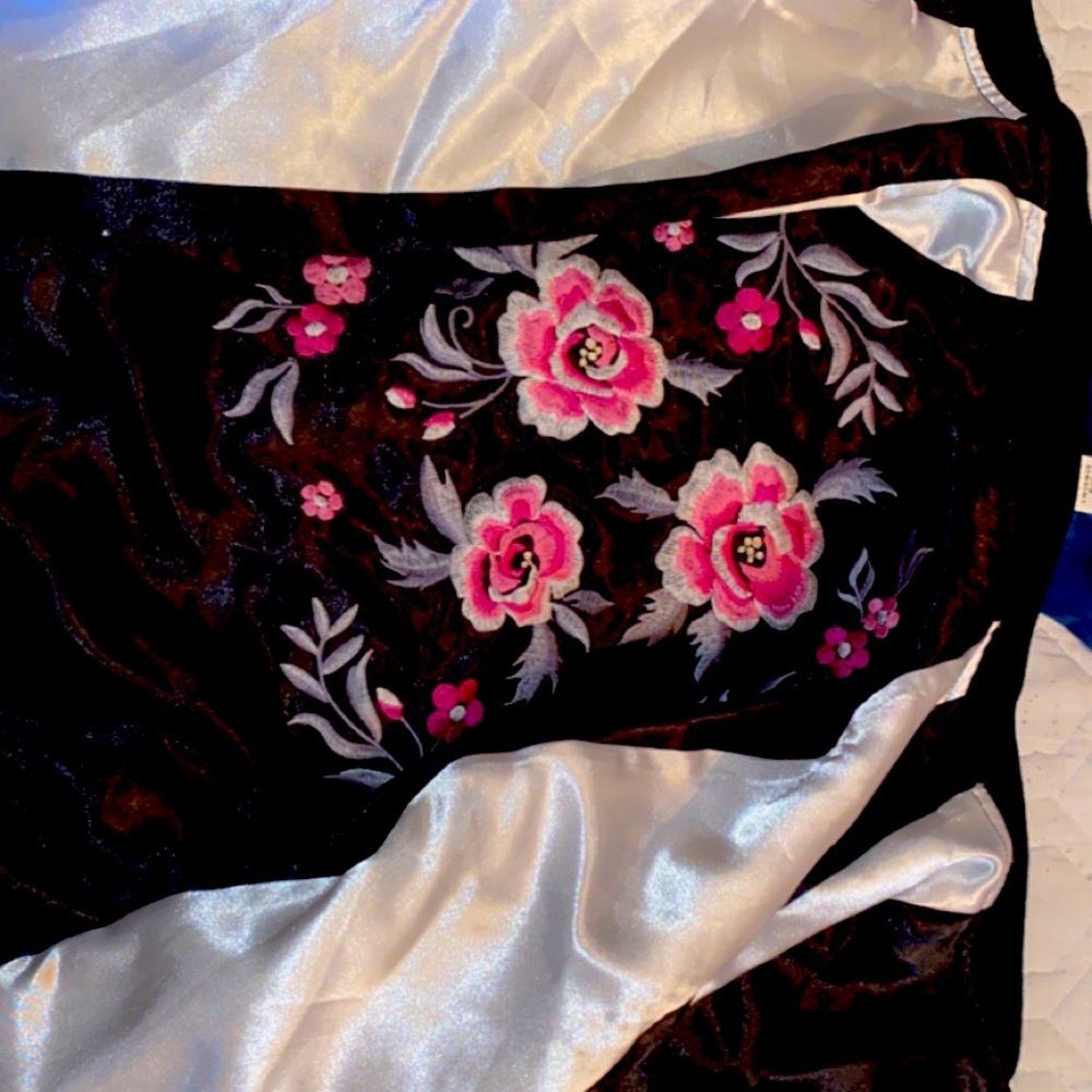 This is a pink flower with grey and white jacket